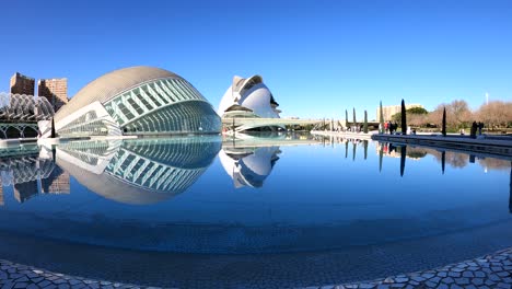 People-walking-at-the-City-of-Arts-and-Sciences,-designed-by-Spanish-architect-Santiago-Calatrava---Valencia,-Spain