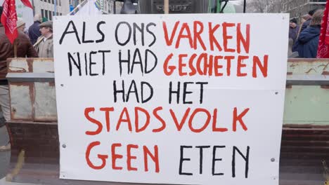Farmers-protesting-against-measures-to-cut-down-nitrogen-emissions-with-sign-"If-the-pig-does-not-shit,-the-people-have-no-food"---Brussels,-Belgium