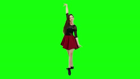 Happy-young-woman-slowly-dancing-and-smiling-in-a-green-screen-background