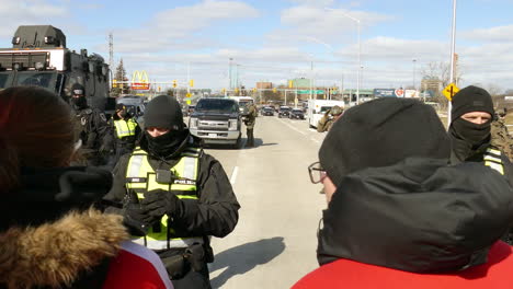 Special-police-and-army-block-the-road-from-the-protesters,-Freedom-convoy-Windsor