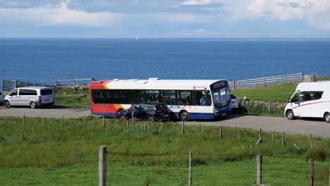 Stuck-Volvo-B7RLE-bus-of-Stagecoach-transportation-company-because-of-irresponsible-SUV-driver-in-Scottish-landscape-on-narrow-road