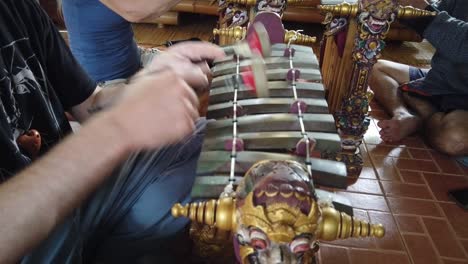 Gamelan-Gender-Wayang-Instruments,-Bali-Indonesia-Asia-Music-Arts-Hands-of-Player-Hits-the-Percussive-Ancient-Bronze-Keys-of-Shadow-Puppet-Theatre