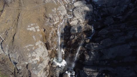 Aerial-descent-to-Arpenaz-waterfall-in-Sallanches,-French-Alps