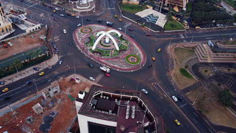 Static-drone-shot-of-traffic-at-the-Prime-Ministerial-Roundabout,-in-Yaounde,-Cameroon