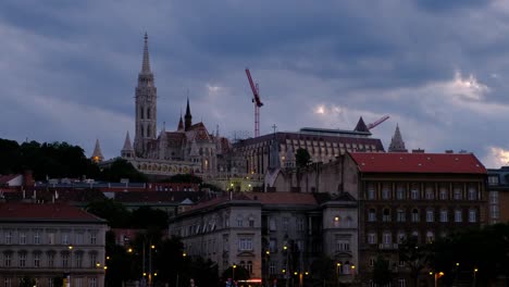 Fisherman's-Bastion-fortress-in-Budapest,-Hungary-shot-during-the-golden-hour-twilight-evening-from-the-Danube-River