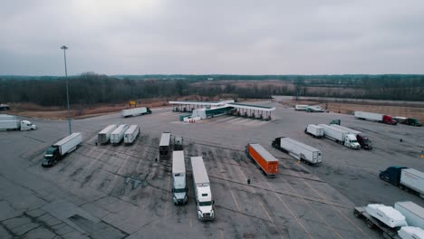 Truck-stop-parking-lot-and-pumps-aerial-view