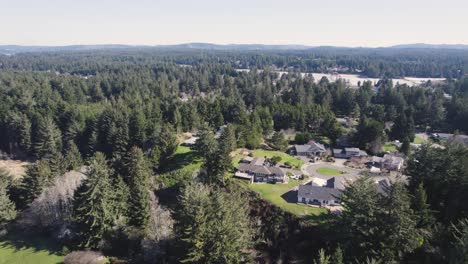 Beautiful-4K-aerial-shot-showcasing-residential-home-in-Bandon,-Oregon-during-golden-hour-sunset