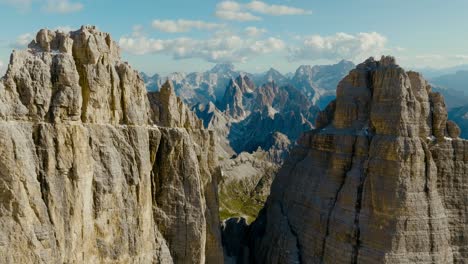 Aerial-drone-shot-going-through-the-middle-of-the-Tre-Cime-di-Lavaredo-in-the-Dolomites-Alps-in-Italy,-4k