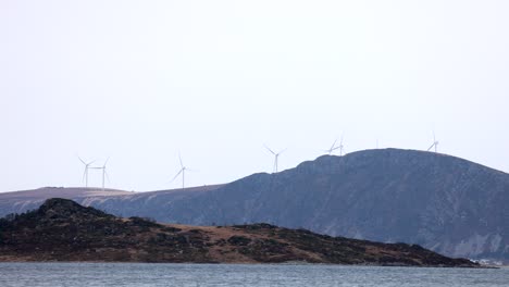 Hestøya-with-Haramsøya-and-the-wind-turbines-on-Haramsfjellet-in-the-background