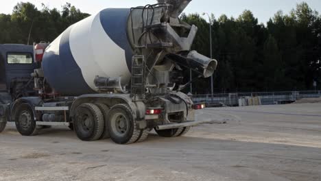 Cement-truck-backing-up-on-construction-site