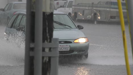 Cars-drive-through-flooded-roads