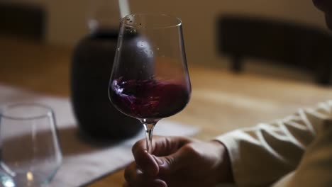 Red-wine-rolling-in-a-glass