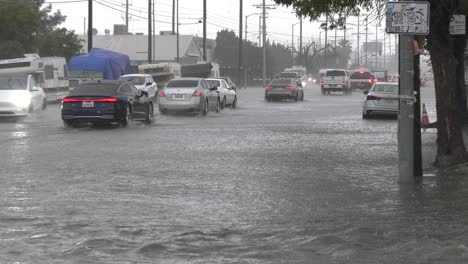 cars-try-to-drive-on-flooded-roads