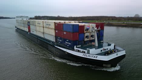 Cargo-ship-Felicitas-navigating-around-the-port-of-Rotterdam,-near-Zwijndrecht