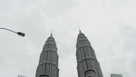 Tilt-shot-of-Twin-towers-Menara-Berkembar-Petronas-Kuala-Lumpur-Malaysia-cloudy-day