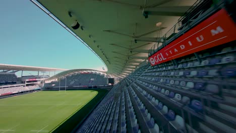 Empty-football-stadium-FPV-aerial-in-Montpellier,-France
