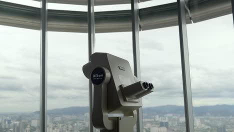 Nikon-binoculars-inside-Menara-Berkembar-Petronas-Kuala-Lumpur-Malaysia-tilt-shot