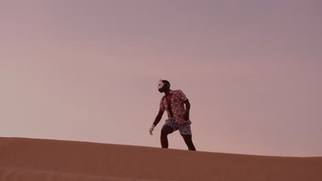 African-American-man-dancing-Uganda-style-in-desert