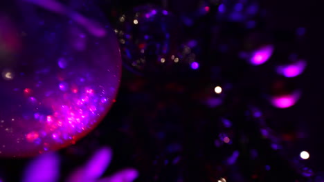 Christmas-tree-decorations-at-night-with-purple-lights