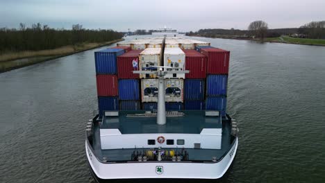 Aerial-view-of-the-front-side-of-the-containership-on-the-Oude-Maas-Canal-in-South-Holland