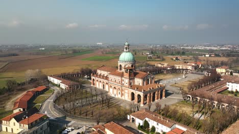 A-drone-circles-Lombardy's-Santuario-Caravaggio,-capturing-the-stunning-architecture-and-soft-sunlight-of-the-historic-religious-site