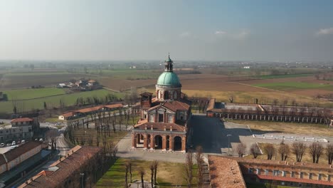 A-stunning-drone-circling-shot-captures-the-beautiful-Lombardy-region's-Santuario-di-Caravaggio,-an-iconic-Italian-pilgrimage-site