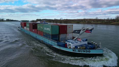 Aerial:-"Mi-Mundo"-Transportation-vessel-going-through-the-canals-of-Zwijndrecht,-The-Netherlands