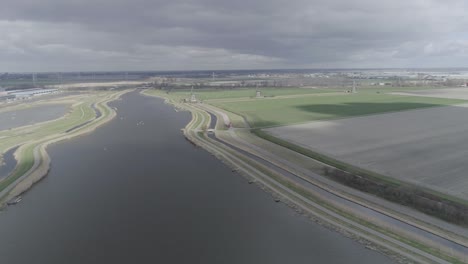 Drone-shot-of-Dutch-landscape-with-city-in-the-background