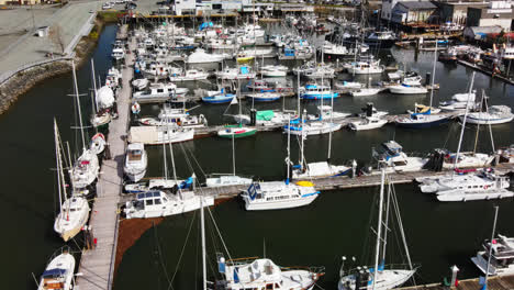 Port-Alberni-Marina-With-Fishing-Boats-And-Yacht-In-Daytime-In-Vancouver-Island,-BC,-Canada