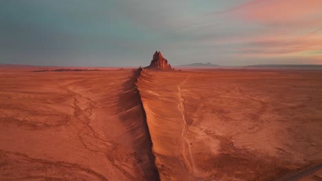 Sunset-Scenery-And-Ship-Rock-Stone-Formation-In-Northwestern-New-Mexico---aerial-drone-shot
