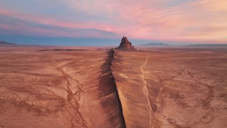 Deserted-Landscape-Around-Ship-Rock,-New-Mexico-At-Sunset---drone-shot