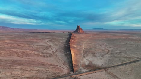 Ship-Rock-Rock-Formation-In-A-Vast-Landscape-In-Northwestern-New-Mexico---aerial-drone-shot