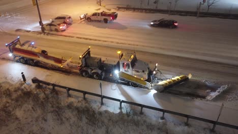 Big-rig-tow-plow-stuck-on-road-skidding-in-snow-and-ice