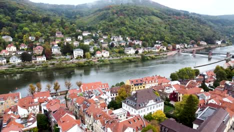 Drone-Shot-of-Heidelberg,-Germany,-Old-Town,-Neckar-River-and-Bridges,-Aerial-Panorama