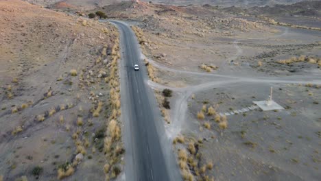 Aerial-View-Of-Car-Driving-Along-RCD-Road-Through-Balochistan