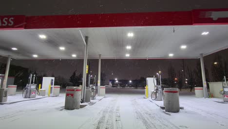 Gas-station-desolate-in-Winter-snowfall-at-night