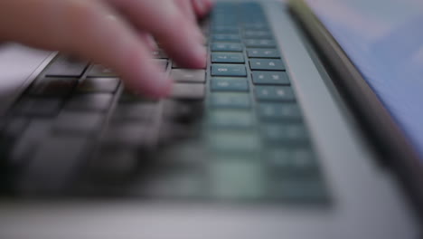 person-typing-fast-on-a-laptop-computer-keyboard