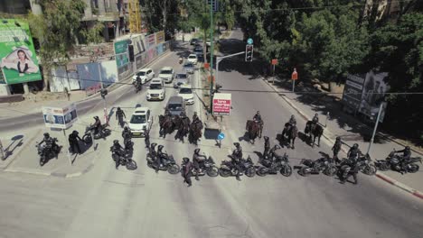 Police-officers-with-horses-and-motorcycles-are-blocking-a-road-against-Israeli-citizens-protesting-against-the-government