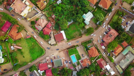 Aerial-drone-view-from-above-of-a-street-with-numerous-cars-in-Kampala,-Uganda,-Africa