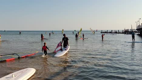 Jastarnia,-Poland,-July-12,-2022:-Windsurfing-Boards-and-Kites-on-a-Beach