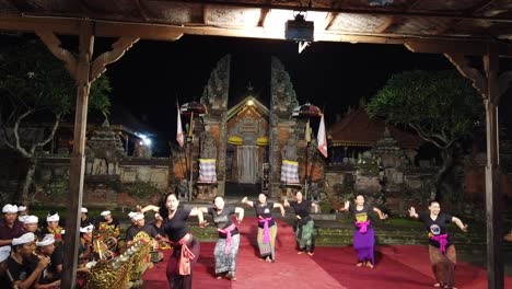 Balinese-Beautiful-Women-Dancing-Legong-in-Bali-Temple-at-Night,-Gamelan-Music-in-Indonesia-Southeast-Asia
