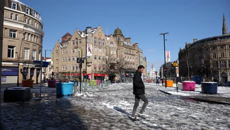 Melting-snow-and-slush-in-Sheffield-city-centre-on-sunny-day