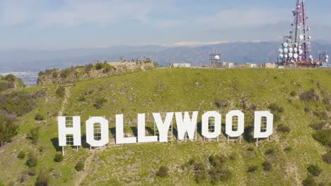 Spectacular-Aerial-of-Hollywood-Sign-with-Snowy-Mountains-in-Los-Angeles