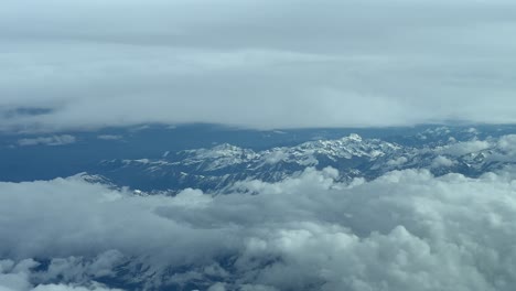 Dramatic-aerial-view-of-The-Pyrenees-snowy-mountains-in-Spain,-in-a-cold-winter-day