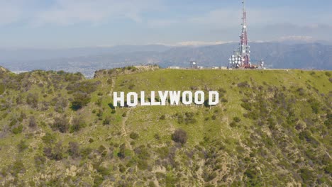 Amazing-Aerial-of-Hollywood-Sign-with-Snowy-Mountains-in-Los-Angeles