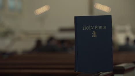 Holy-Bible-Resting-in-Church---Blurred-Background