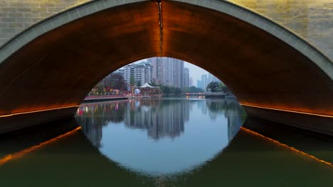 Aerial-Drone-Flight-under-Bridge-in-Downtown-Chengdu,-China---Cinematic