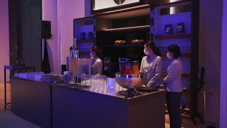 Hotel-staff-serve-guests-from-a-stunning-beverage-stand