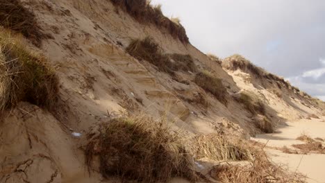 Coastal-erosion-of-Sandunes-on-Hemsby-Beach,-Wide-shot