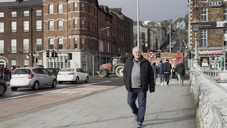 St-Patricks-Bridge-crossing-with-busy-road-and-pedestrians-in-Cork-City